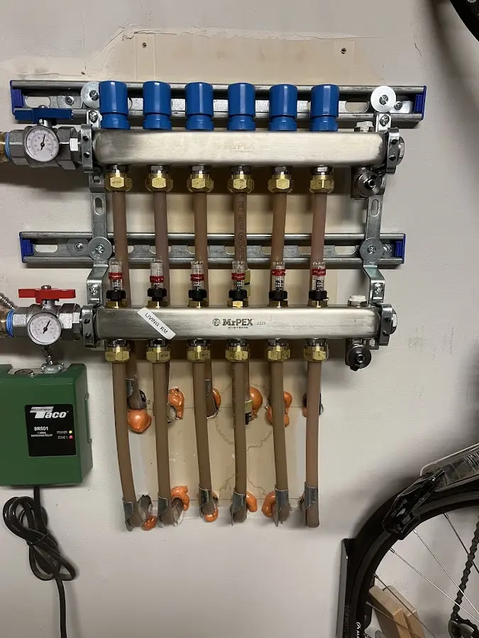 Plumber performing Water Heater Repair at a residential property in Raymondville